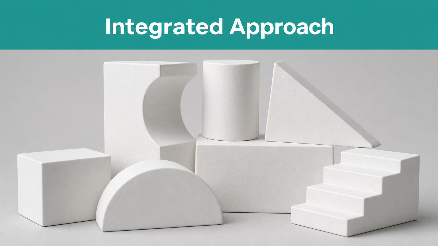 A collection of various white geometric shapes arranged together, representing an integrated approach concept.