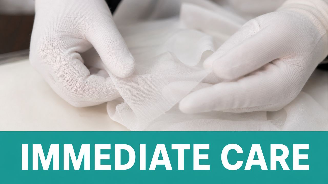 A medical professional wearing white gloves holds a piece of clean, white medical gauze for wound care.