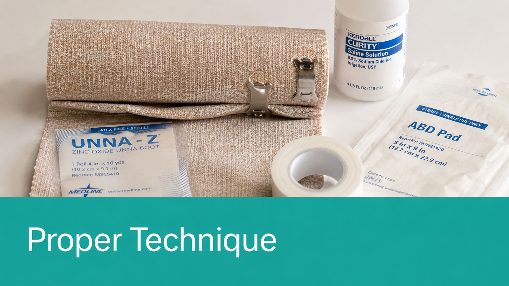 A collection of medical supplies including an Unna boot bandage, saline solution, ABD pad, and medical tape.